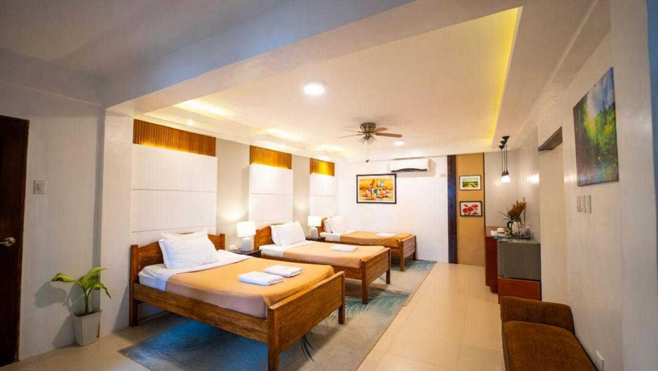 Premier deluxe room bed at La Luz Beach Resort