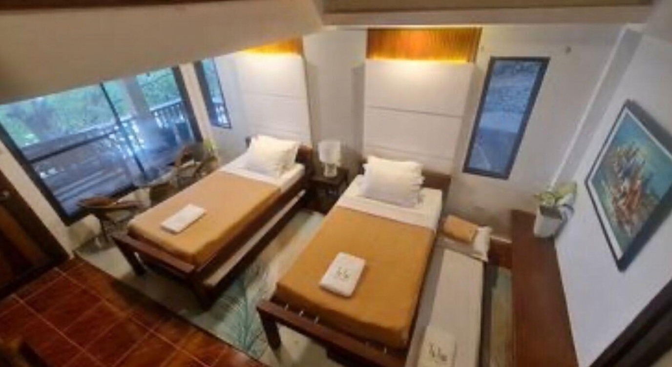 Premier loft room bedroom at La Luz Beach Resort