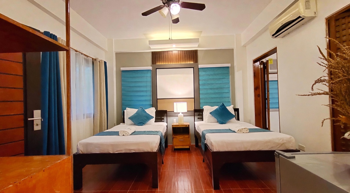 Premier room bed at La Luz Beach Resort